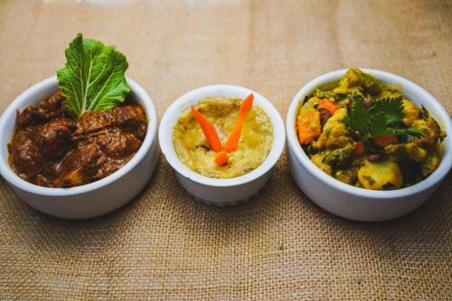 a group of three bowls of food on a table at Story Villa 1 Bedroom with Ocean & Mountain View in Canaries
