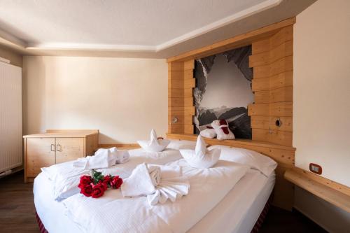 Ein Bett oder Betten in einem Zimmer der Unterkunft Berg Hotel Latemar Spitze