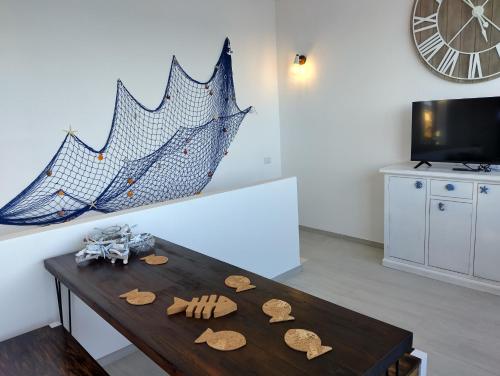 a living room with a table with cookies on it at La Medusa in La Ciaccia