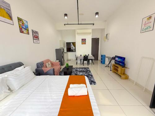 a bedroom with a bed and a living room at 3 Towers Jalan Ampang By Serenity Vacation Homes in Kuala Lumpur