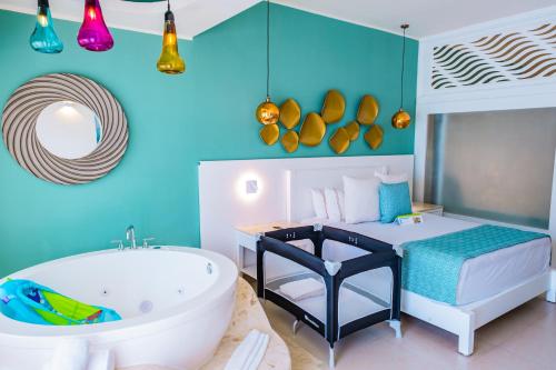 Selection Riviera Cancún- All Inclusiveにあるベッド