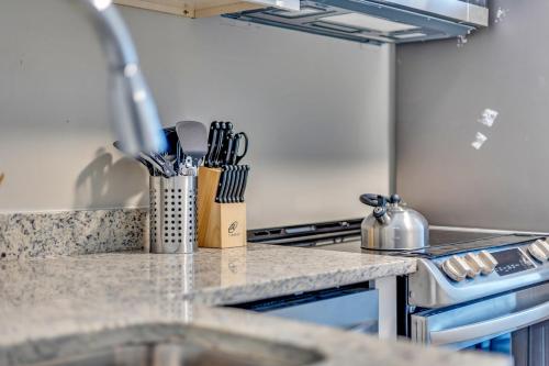 a kitchen counter with a sink and a stove at Beautiful House Mins Away From the Airport in Atlanta