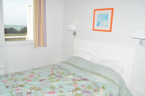 Ένα ή περισσότερα κρεβάτια σε δωμάτιο στο Appartements front de Mer SABLES D'OLONNE