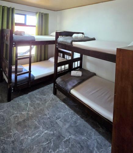 Ein Bett oder Betten in einem Zimmer der Unterkunft Hostel Cattleya - Monteverde, Costa Rica