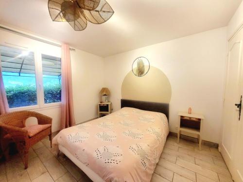 a bedroom with a bed and a window at Appartement Sophie à Vals les bains in Vals-les-Bains