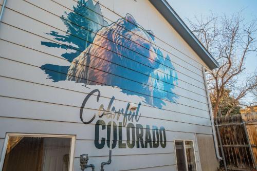 a building with a peacock painted on it at Runaway Escapade! Hot Tub, BBQ & Fire Pit in Colorado Springs