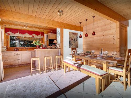 a kitchen and dining room with a table and chairs at Chalet J'Elage - OVO Network in Saint-Jean-de-Sixt