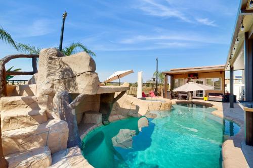 a water slide at a resort with a swimming pool at Perris Paradise in Perris