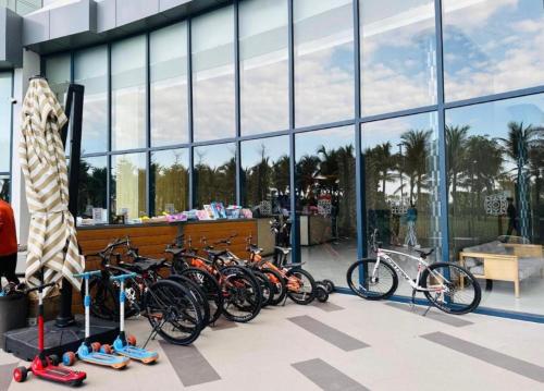 a bunch of bikes parked in front of a building at The Mango - Arena Cam Ranh Beachfront Resort - 5 Star in Cam Ranh International Airport