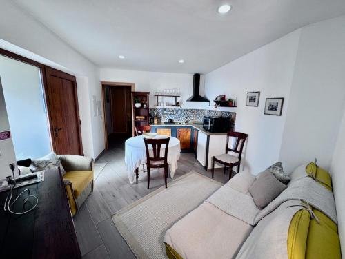 a living room with a couch and a table at Quinta da Baldieira in Mondim de Basto