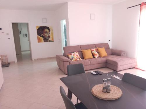 a living room with a couch and a table at Barlavento Residence Estoril beach - Sal Rei City in Sal Rei