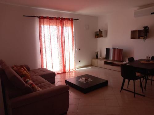 a living room with a couch and a table at Barlavento Residence Estoril beach - Sal Rei City in Sal Rei