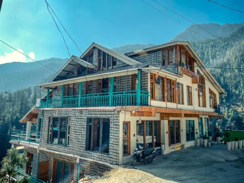 a house being built on top of a mountain at The Elevia, Jibhi in Jibhi