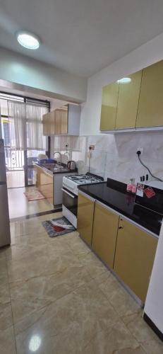 Una cocina o cocineta en Avalor Suites - Marcus Garvey
