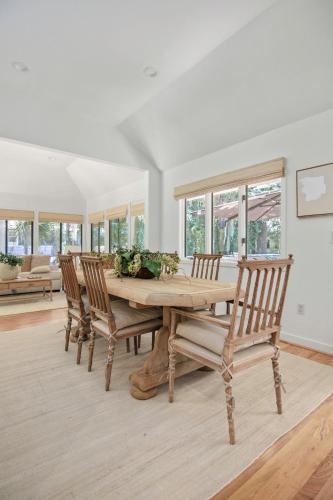 a dining room with a wooden table and chairs at 2908 Captain Sams in Seabrook Island
