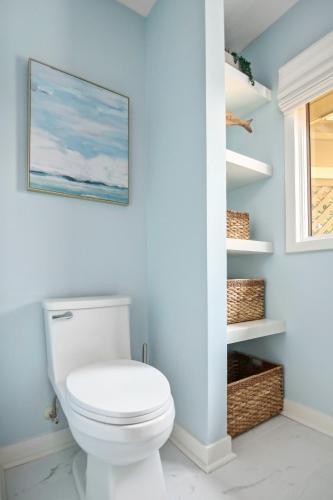 a bathroom with a white toilet in a room at 2908 Captain Sams in Seabrook Island