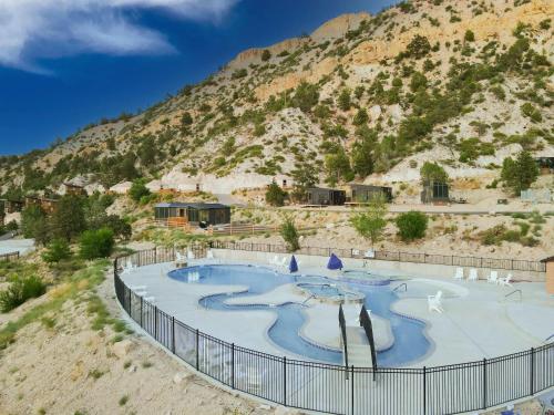 a swimming pool in the middle of a mountain at Yurt Overlook #6 with AC and Private Bath 2 Kings in Orderville