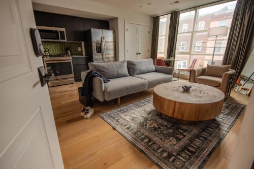 a living room with a couch and a coffee table at Sosuite at The Jefferson - Fishtown in Philadelphia