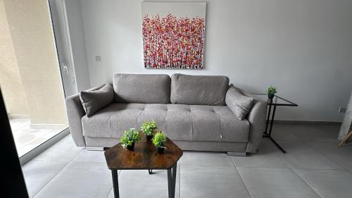 a living room with a couch and a table at Paceville StJulians centre near Beach in Paceville