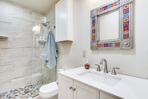 a bathroom with a sink and a toilet and a mirror at Peaceful and Historic Home in Patagonia! in Patagonia