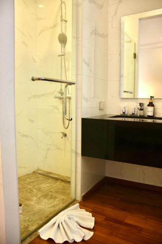 a bathroom with a shower and a sink at Chic Villa 6 in Chiang Mai