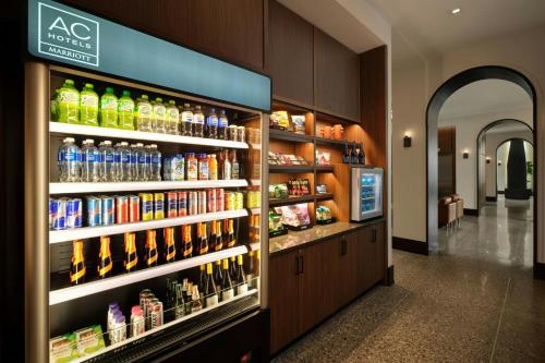 a store filled with lots of bottles of soda at AC Hotel Detroit at the Bonstelle in Detroit