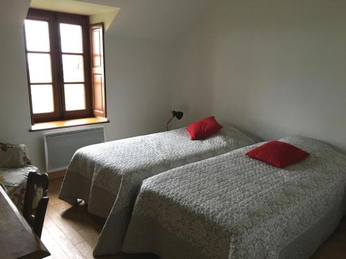 En eller flere senge i et værelse på Charmante ferme vue exceptionnelle 10 voyageurs