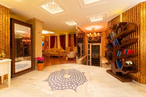 a living room with a book shelf and a living room at Ayasofya Hotel - Special Class in Istanbul