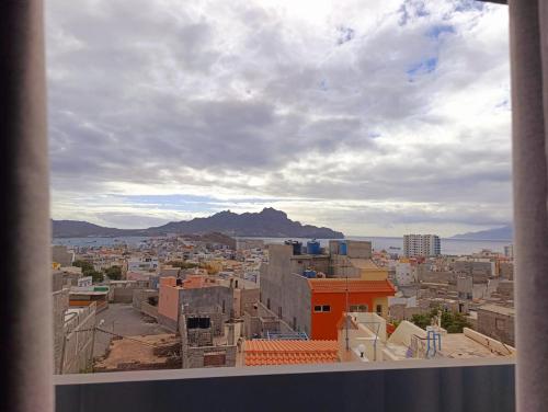 a view of a city from a window at Elly Apartamentos in Mindelo