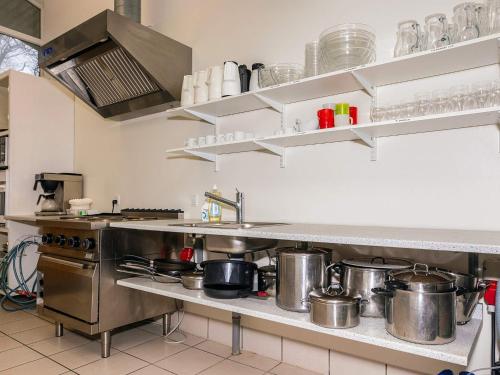 a kitchen with pots and pans on the counter at Budget Holiday Stay on Læsø Island in Læsø