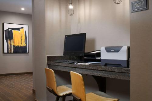 a office with a printer and a computer on a desk at Sonesta ES Suites Dallas Richardson in Richardson