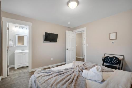 a white bedroom with a bed and a sink at Judkins Entire Upper Floor - Close to Downtown in Seattle