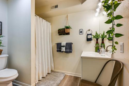 a bathroom with a sink and a toilet at Deck and Mountain Views Cedar City Family Home! in Cedar City