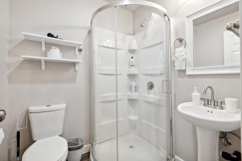 a bathroom with a shower and a toilet and a sink at Judkins Entire Upper Floor - Close to Downtown in Seattle