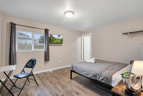 a bedroom with a bed and a desk and a chair at Judkins Entire Upper Floor - Close to Downtown in Seattle