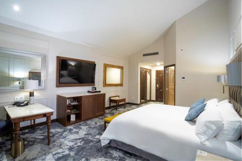 Cama o camas de una habitación en Quinta Real Saltillo