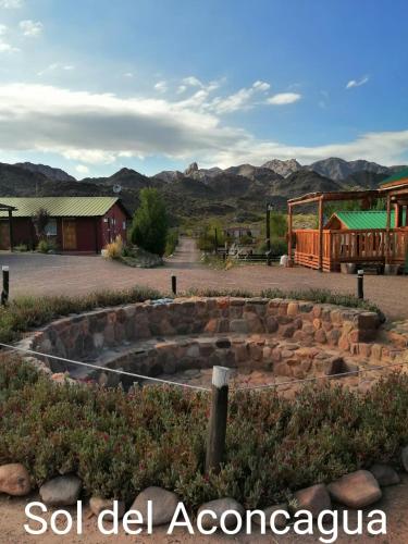a stone amphitheater with mountains in the background at Posada Malbec 3 Dormis in Uspallata