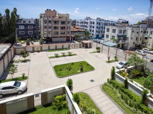 an aerial view of a parking lot in a city at Marjaan Apartments in Mombasa