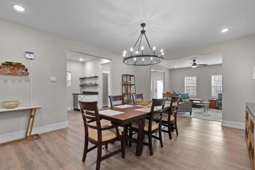 a dining room and living room with a table and chairs at 3325 Bright Urban Comfort in Tower Grove