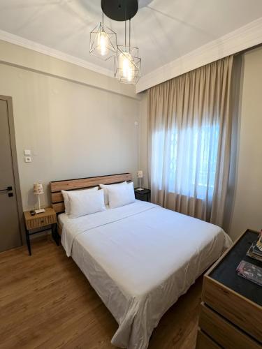 Ένα ή περισσότερα κρεβάτια σε δωμάτιο στο Living Life Apartment Komotini