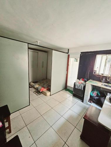 a room with a room with a bed in it at Junior in Sao Paulo