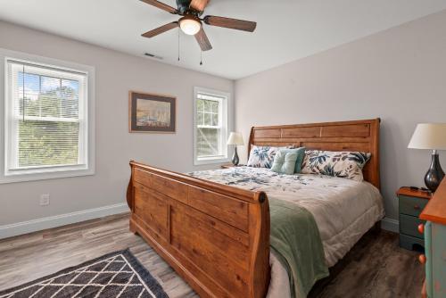 a bedroom with a bed and a ceiling fan at Tranquility - Brand new home in quiet location! in Deep Hole