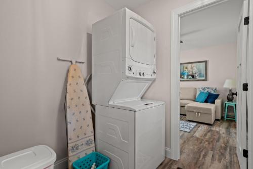 a white cabinet in a bathroom with a sink at Tranquility - Brand new home in quiet location! in Deep Hole