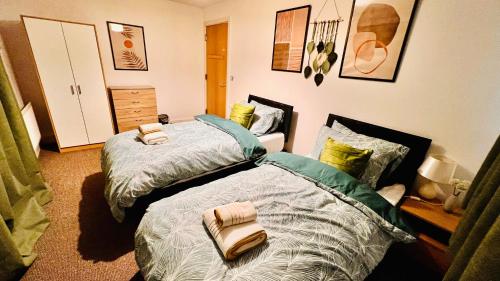a bedroom with two beds next to each other at Birmingham City Centre Apartment with Parking in Birmingham