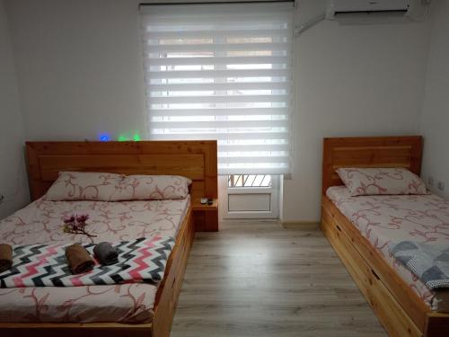 Postel nebo postele na pokoji v ubytování Apartman N&N
