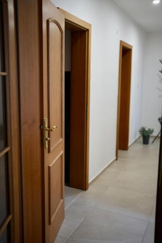an open door with a hallway with three doors at Ubytování U Pivovaru in Kamenice nad Lipou