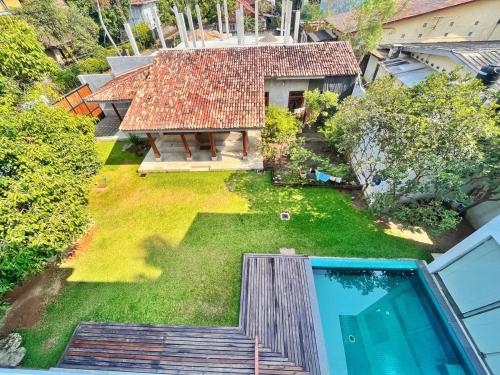an aerial view of a house with a swimming pool at Sanctuary Ceylon by Ceylon Spaces in Mount Lavinia