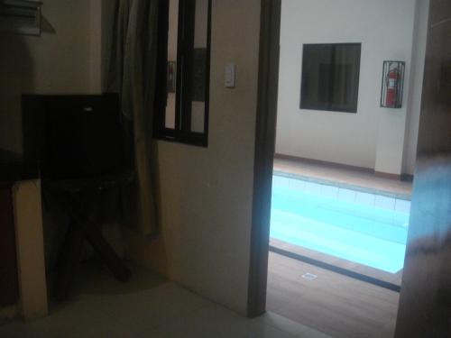 a view of a swimming pool in a room at Hidden Pearl Hotel (Janus Luxury Suites) in Angeles
