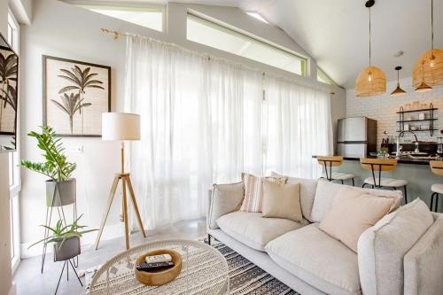 a living room with a white couch and a table at Beautiful & Boho 2BR Villa 14 at Playa Venao in Playa Venao