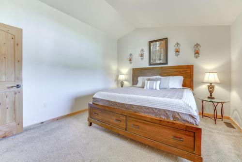 a bedroom with a large bed and a dresser at 2 Mi to Dinosaur Journey Museum Mtn-View Haven! in Fruita